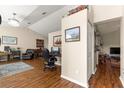 Home office space with built-in shelving and hardwood floors at 5137 Nw 20Th Pl, Ocala, FL 34482