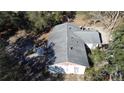An aerial view shows the home's roof, surrounding trees, and outdoor patio area at 5625 Sw 181St Ct, Dunnellon, FL 34432