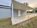 Covered patio with concrete flooring, adjacent to the house at 5739 Se 163Rd Ct, Ocklawaha, FL 32179