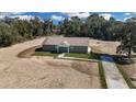 New construction home featuring concrete driveway and front yard grass at 5885 Sw 169Th Ct, Ocala, FL 34481