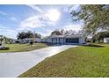 Ranch home with long driveway and beautiful lawn at 6460 Sw 111Th St, Ocala, FL 34476