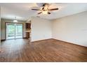 Spacious living room with wood-look floors and ceiling fan at 7567 Sw 108Th Pl, Ocala, FL 34476