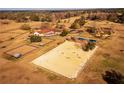 Expansive aerial view of equestrian estate with horse training facilities, paddocks, and residence at 8250 Nw 136Th Avenue Rd, Ocala, FL 34482