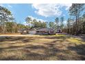 Single story home with a large yard and detached workshop at 13700 Sw 71St Ln, Ocala, FL 34481