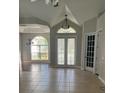 Welcoming foyer with tile flooring, leading to the living spaces with natural light and a view to the dining area at 1908 Sw 28Th St, Ocala, FL 34471