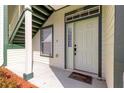 Front door entry to townhome with a welcome mat at 231 Ne 28Th Ave # 301, Ocala, FL 34470