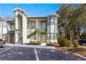 Front view of two-story townhome, green trim at 231 Ne 28Th Ave # 301, Ocala, FL 34470