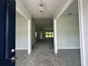 Inviting foyer with tile flooring, neutral colors, and an open view to the living area at 35 Locust Radial Cir, Ocala, FL 34472