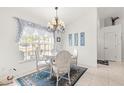 Charming dining area with white table and chairs, and decorative rug at 5077 Sw 107Th Loop, Ocala, FL 34476