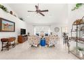 Bright and spacious living room with tiled floors and comfy seating at 5077 Sw 107Th Loop, Ocala, FL 34476