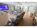 Bright living room featuring hardwood floors and comfy seating at 5991 Nw 61St Ct, Ocala, FL 34482