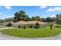 Single-story home situated on a large corner lot with mature trees at 6558 Se 9Th Pl, Ocala, FL 34472