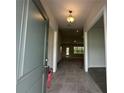 Inviting entryway with tile flooring and a view into the spacious, light-filled living area at 77 Olive Dr, Ocala, FL 34472