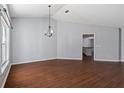 Bright dining room with hardwood floors and view into kitchen at 7795 Sw 181St Cir, Dunnellon, FL 34432