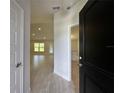 View from the front door showing tile flooring and an open-concept living space at 10927 Sw 41St Ave, Ocala, FL 34476
