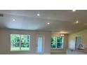 Bright living room with natural light, featuring views of the backyard and an open floorplan at 13 Nw 45Th Loop, Ocala, FL 34475