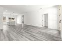 Bright living room featuring gray vinyl flooring and open floor plan at 15413 Sw 65Th Terrace Rd, Ocala, FL 34473