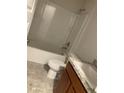 Clean bathroom with a tub, toilet and vanity with granite countertop at 3 Olive Way, Ocala, FL 34472