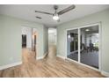 Open living area with tile floors and sliding glass doors to the screened patio, great for entertaining at 331 Oak Lane Dr, Ocala, FL 34472