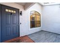 Inviting entryway with gray door and modern tile flooring at 4 Hickory Track Trce, Ocala, FL 34472