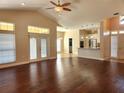 Spacious living room with hardwood floors, high ceilings, and French doors at 4117 Sw 30Th Ct, Ocala, FL 34474