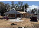 An exterior view showing the home under construction with framing and roof being built at 7 Nw 45Th Loop, Ocala, FL 34470