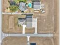 Aerial view showing a home, pool, and airplane near a runway at 7225 Se 92Nd St, Ocala, FL 34472