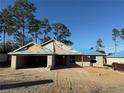 New house under construction, block walls, and a blue tarp roof at 8781 Se 161St Pl, Summerfield, FL 34491