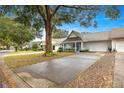 Neatly landscaped community with villas and tree-lined street at 8785 Sw 91St St # B, Ocala, FL 34481