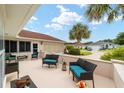 Outdoor patio with seating area and view of neighborhood at 11159 Sw 68Th Ct, Ocala, FL 34476