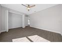 Bedroom with vinyl plank flooring and spacious closet at 14898 Se 35 Ct, Summerfield, FL 34491