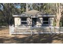 Charming one-story home featuring a white picket fence and neutral exterior paint color at 2515 Nw 63Rd Pl, Ocala, FL 34475