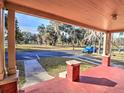 View from the front porch showcasing a tree-lined street at 309 Ne Sanchez Ave, Ocala, FL 34470