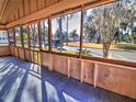 Bright screened porch overlooks a tree-lined street at 317 Ne Sanchez Ave, Ocala, FL 34470