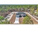 New home construction aerial view showcasing a single-story home with driveway at 8786 Sw 127 Ave, Dunnellon, FL 34432