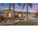 Charming single-story home exterior featuring a well-lit facade, inviting entrance, and manicured landscaping at 9651 Se 137Th Street Rd, Summerfield, FL 34491