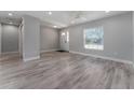 Bright and airy living room with wood-look flooring at 1302 Ne 22Nd Ave, Ocala, FL 34470