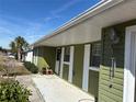 House exterior showcasing the front entrance and a tiled patio area at 15083 Sw 43Rd Terrace Rd, Ocala, FL 34473