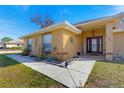 House exterior showcasing walkway, landscaping, and entryway at 15391 Se 90Th Ct, Summerfield, FL 34491