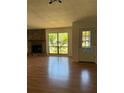 Living room featuring stone fireplace and natural light at 1804 Sw 29Th Ter, Ocala, FL 34474