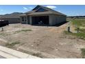 Charming single-story home with a covered entrance and an attached two-car garage awaiting landscaping at 3212 Ne 46Th Ave, Ocala, FL 34470