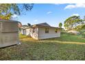Back of house with shed and spacious yard at 438 Spring Ln, Ocala, FL 34472