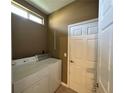 Convenient laundry room with washer, dryer, and ample storage at 2352 Nw 53Rd Avenue Rd, Ocala, FL 34482