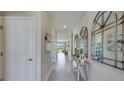 Bright and spacious entryway with tile flooring and decorative mirrors at 4074 Nw 48Th Terrace Rd, Ocala, FL 34482