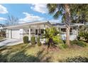 Beautiful single-story home with an attached garage, covered entry, and mature landscaping at 8707 Sw 95Th Ln # G, Ocala, FL 34481