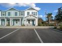 Charming townhome featuring a welcoming entryway with a covered porch and rocking chairs at 3409 Sw 34 Ave Cir, Ocala, FL 34474