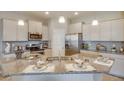 Bright kitchen with granite countertops, stainless steel appliances, and a functional island at 4766 Nw 39Th Street Rd, Ocala, FL 34482