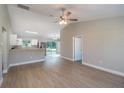 Spacious living room with sleek floors and natural light coming through the sliding glass door at 1 Fisher Lane Way, Ocklawaha, FL 32179