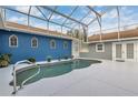 Enclosed pool area showcasing a uniquely designed pool, hot tub, and entertainment space at 11619 Lane Park Rd, Tavares, FL 32778