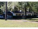 Spacious home exterior, includes porch, screen and yard at 18800 Sw 31St St, Dunnellon, FL 34432